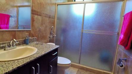 Furnished bedroom with split AC built-in closet curtains at Granada Altos del María Panama