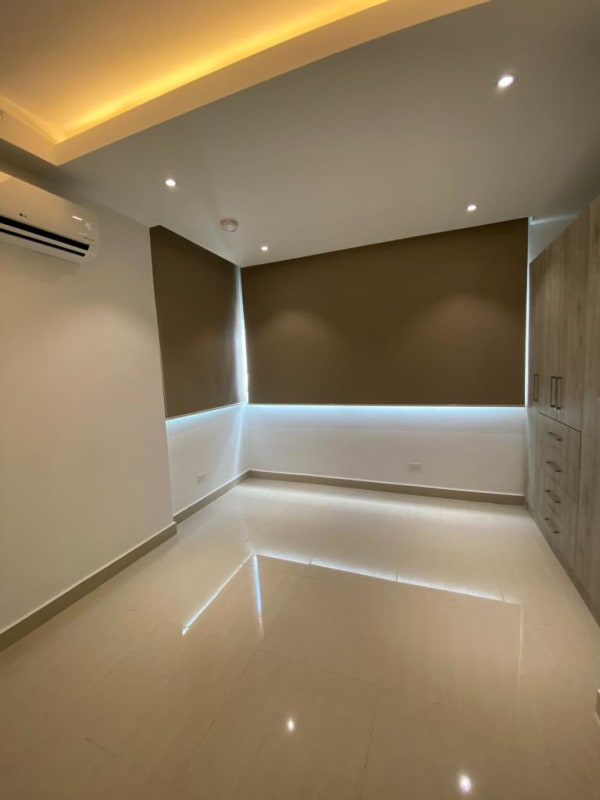 Minimalist bathroom with glass shower, beige tiles, modern vanity PH Green View Bella Vista Panama