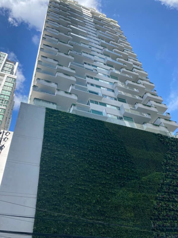 Fully equipped modern gym with yellow accent walls, cardio and weight training equipment, PH Green View Panama