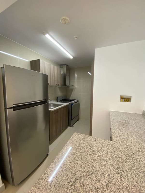 Bright living room with city view, tiled floors, large windows at PH Green View Bella Vista