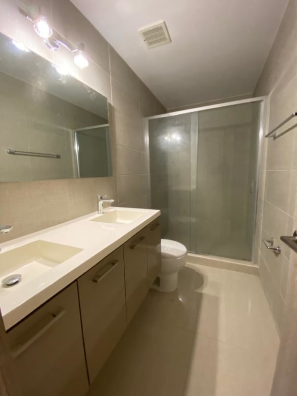 Kitchen with granite counters, stainless steel appliances, and modern cabinetry at PH Green View Bella Vista