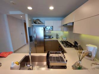 Private furnished balcony with panoramic ocean and pool view in Casamar Resort Panama