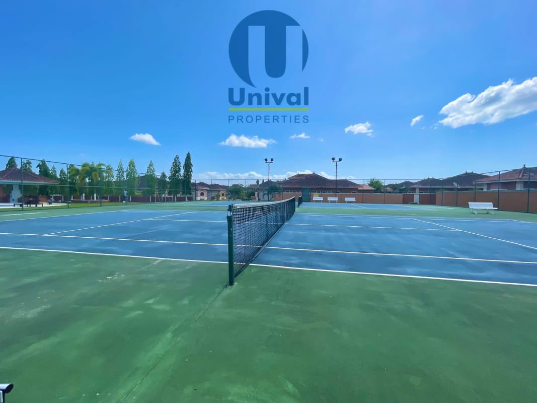 Outdoor tennis courts with seating exclusive community amenities in Costa Sur Panama