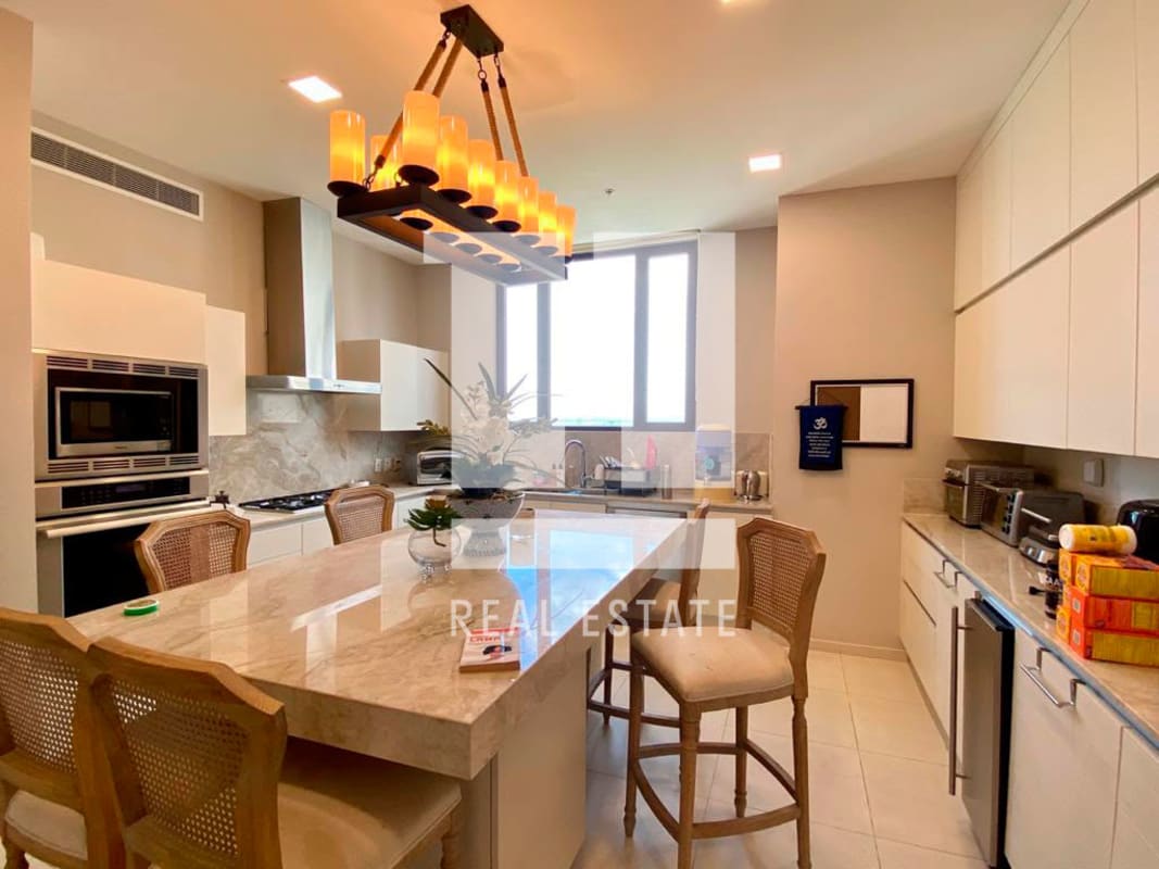 Modern marble kitchen with oversized island, premium appliances at Santa Maria Penthouse Panama