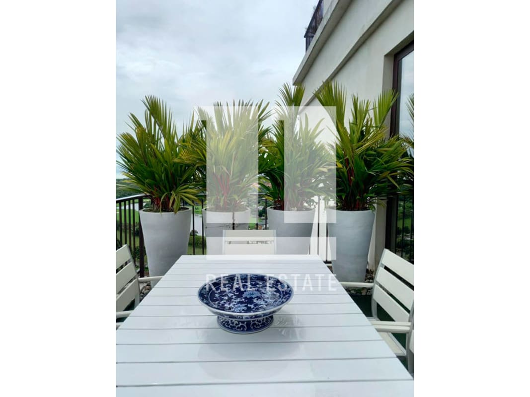 Modern terrace with outdoor dining, pergola roof, panorama over city skyline and lush golf course