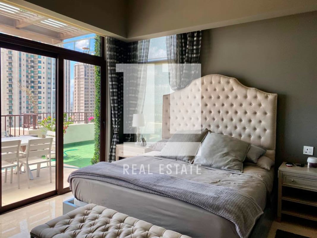 Expansive balcony with lounge seating and panoramic city skyline and golf views in Santa Maria Penthouse