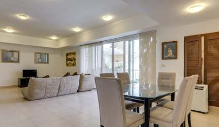 Spacious master bedroom with balcony access golf course views in Tucán Country Club villa