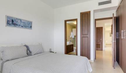 Open kitchen with marble countertops and gas stove in luxury Tucán villa