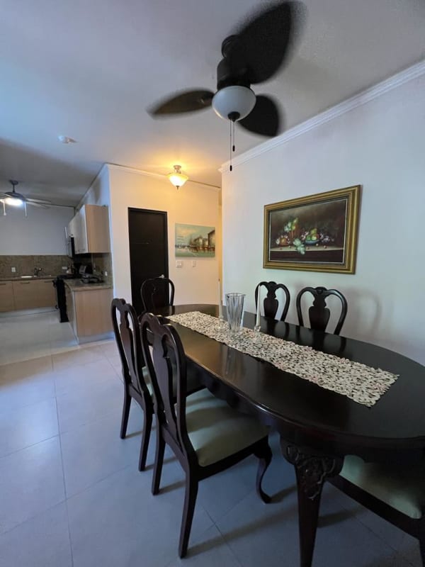 Dining room with tile floors, ceiling fan, adjacent kitchen Embassy Village Clayton Panama