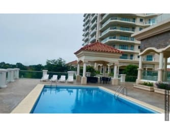 Resort-style pool with gazebo, lounge chairs and garden at Vista Mar Golf & Beach Resort, Panama.