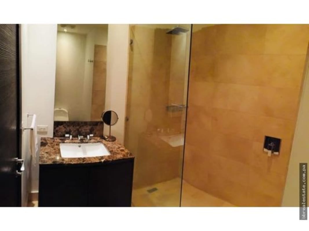 Elegant bathroom with marble vanity, modern fixtures in PH The Ocean Club Punta Pacifica