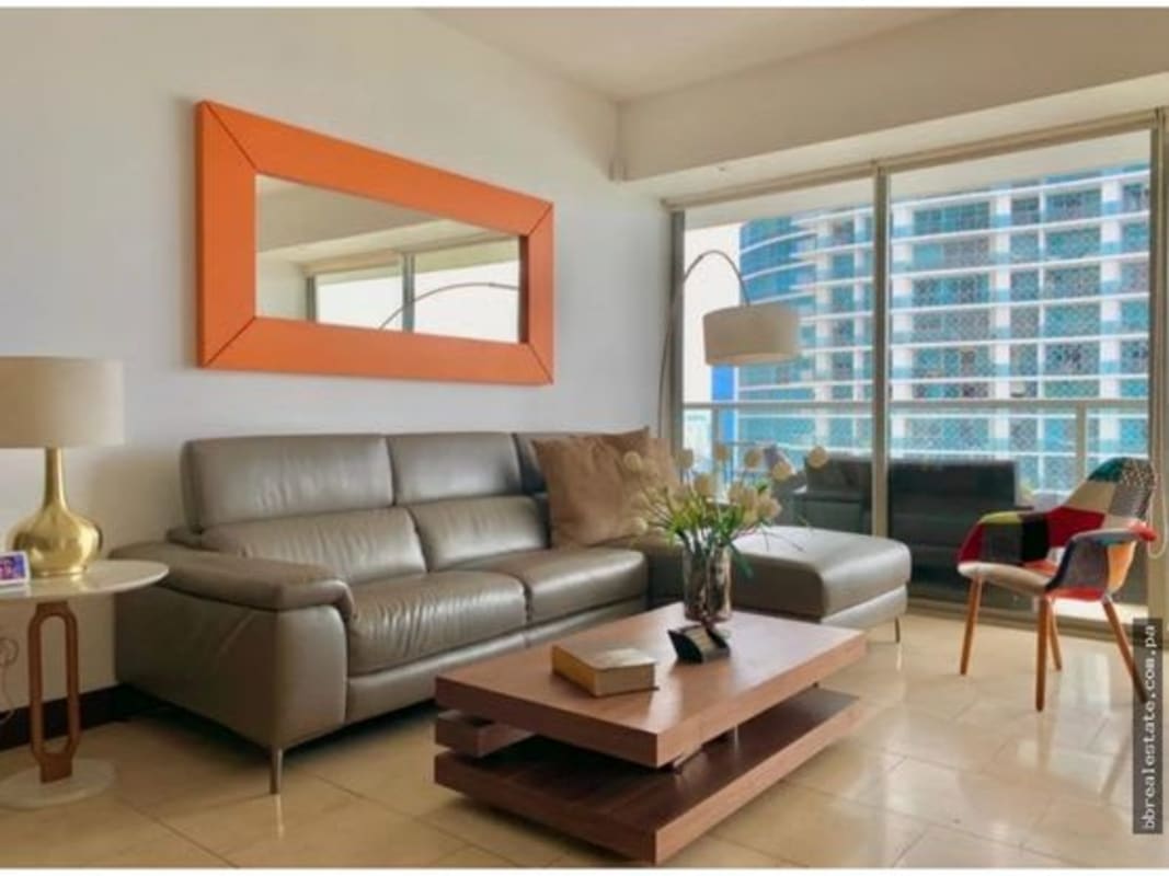 Open living and dining with floor-to-ceiling windows and ocean views PH The Ocean Club