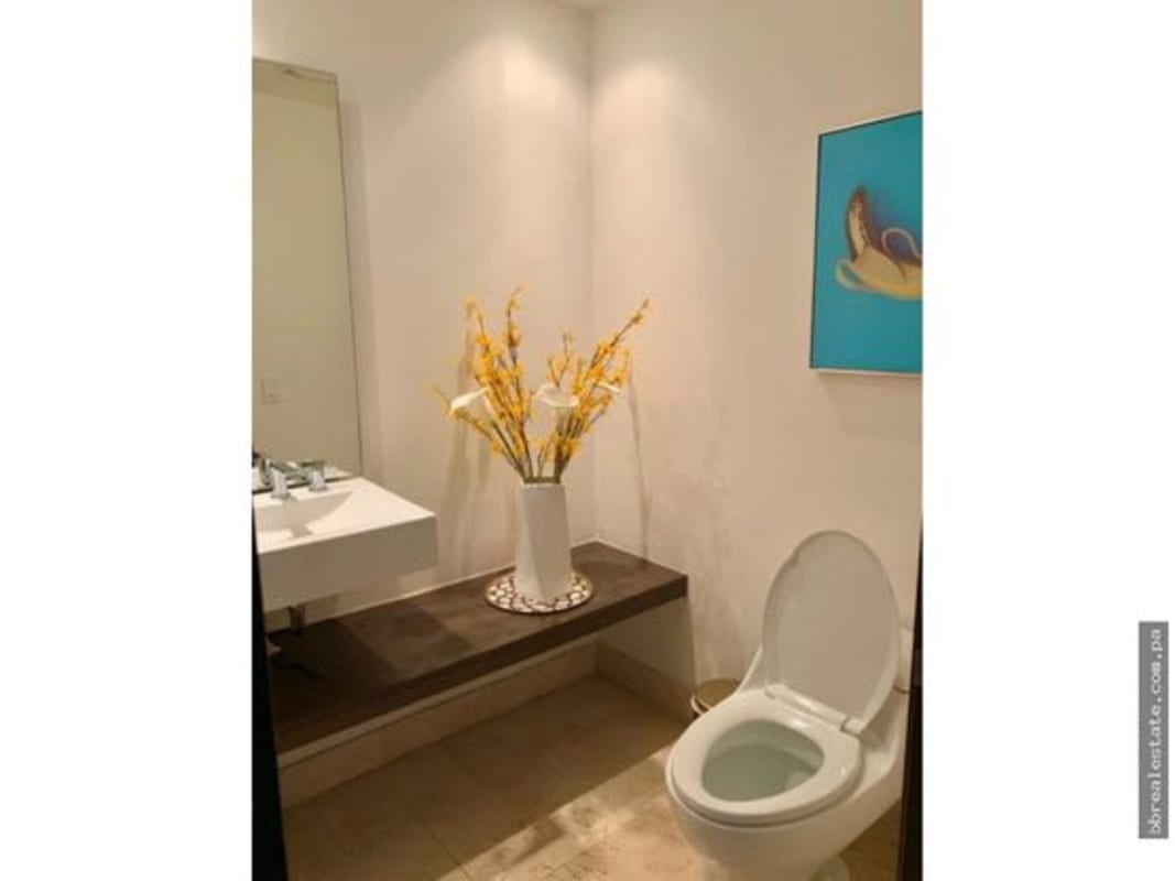 Stylish guest half bathroom with modern fixtures in PH The Ocean Club luxury apartment Panama