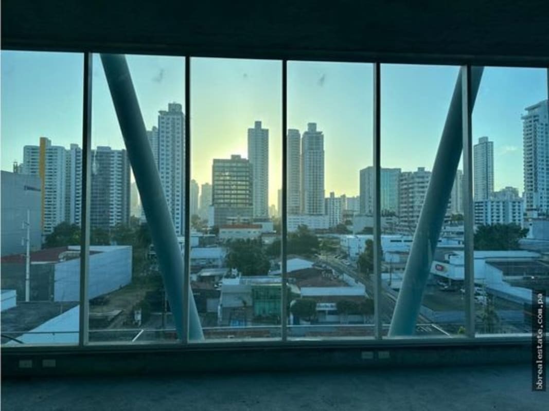 Open-plan unfinished office space with floor-to-ceiling windows and skyline views PH Office 77 Panama