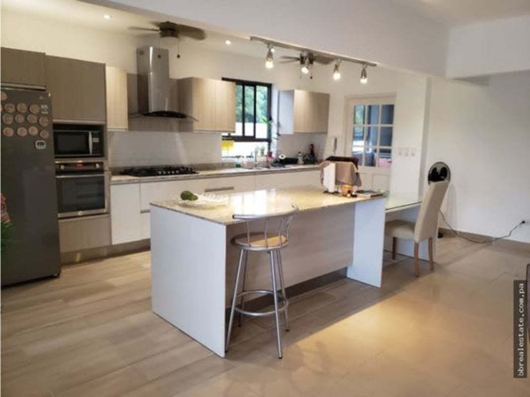 Large kitchen featuring island counter, stainless appliances, modern cabinetry in PH Provenza Diablo