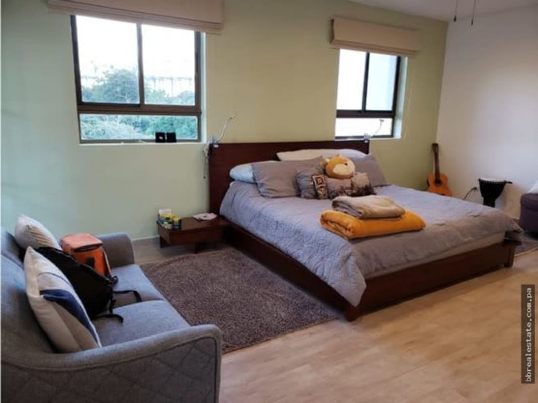 Modern bedroom with large window, abundant light and minimalist decor in PH Provenza Diablo Panama