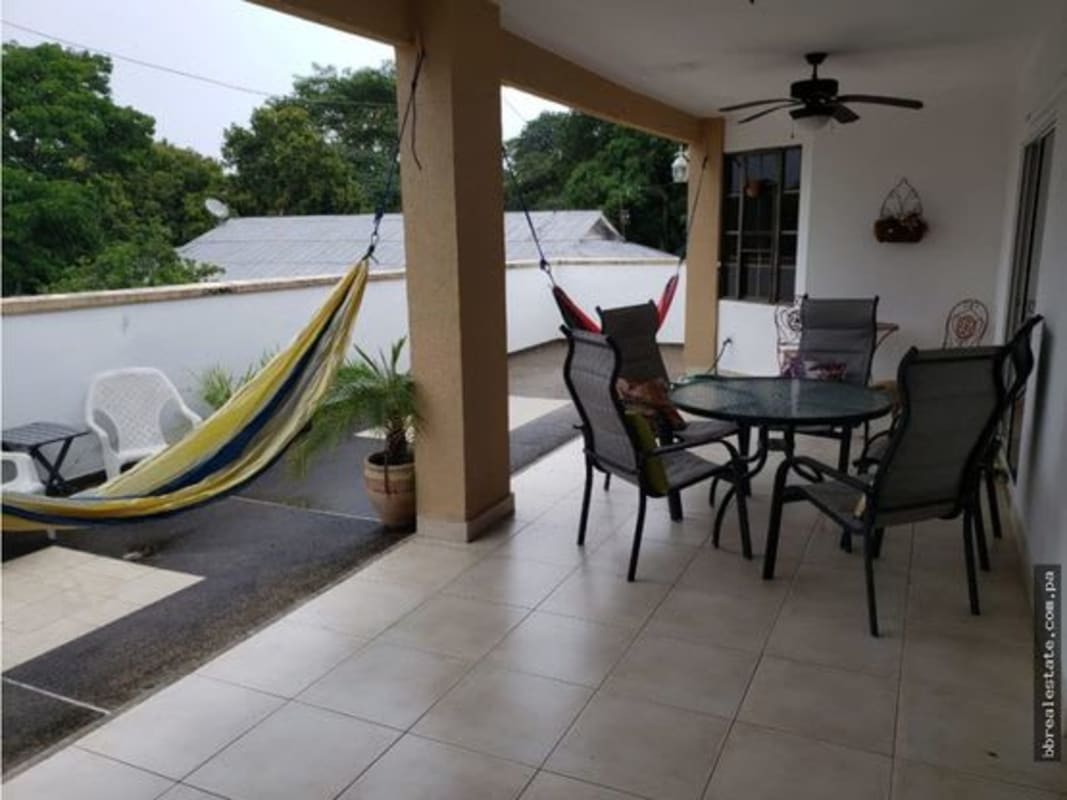 Covered patio with hammocks, potted plants and ceiling fan perfect for gatherings in PH Provenza Panama