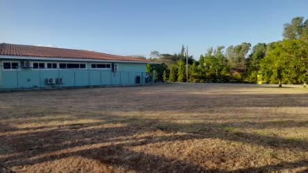 Entrance view to fenced 604 m² lot with grass at Coronado Equestrian Club Panama