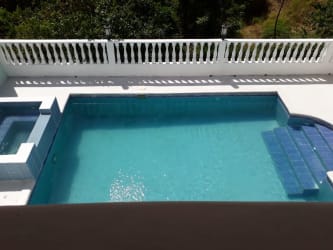 Bright living area with garden views, casual furniture inside Panama beach house