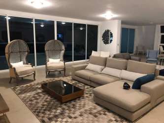 Spacious modern beachfront penthouse living room with ocean views at Santa Clara Residences Panama