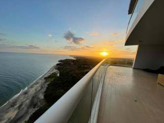 Stunning sunset views from beachfront penthouse balcony at Santa Clara Residences Panama