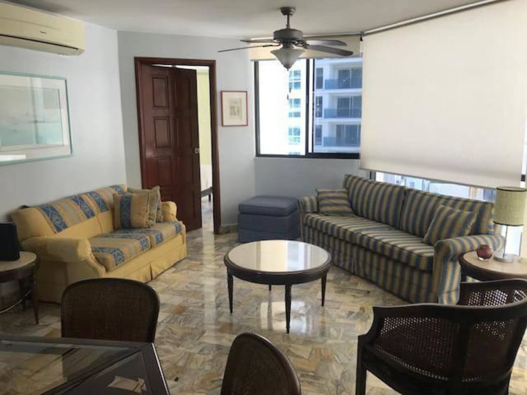 Dining room next to panoramic window overlooking ocean PH BICSA Avenida Balboa Panama City