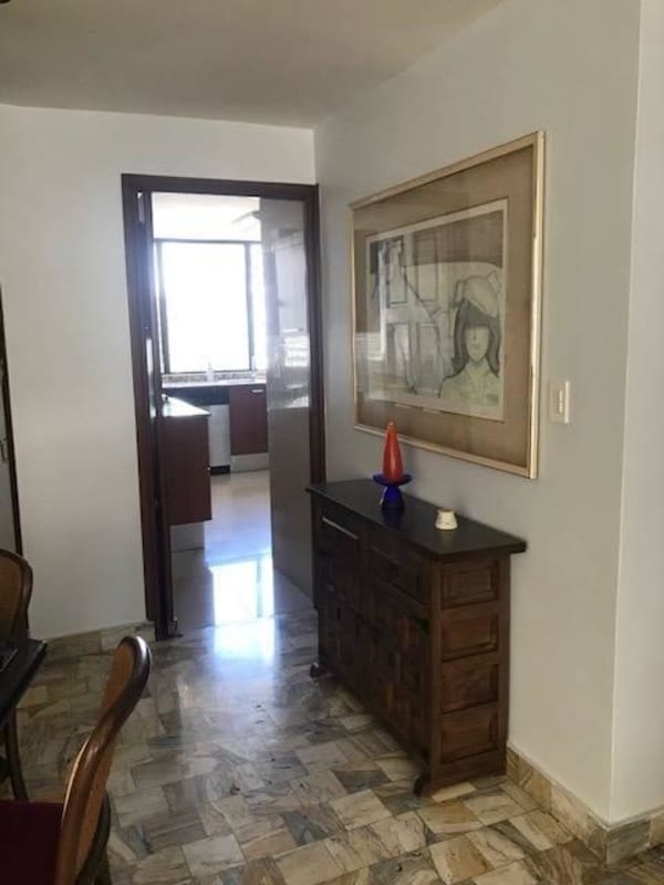 Hallway with marble floors leading to furnished kitchen at PH BICSA Avenida Balboa
