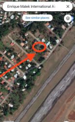 Aerial view of residential zone and Enrique Malek International Airport with highlighted property