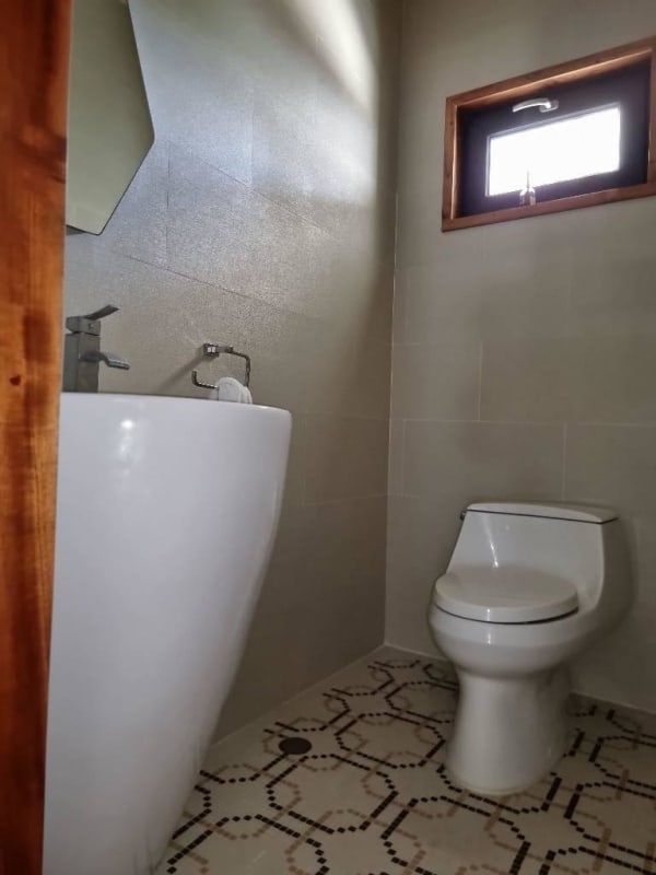 Large covered patio with ceiling fans, stone accents and garden views luxury residence Panama