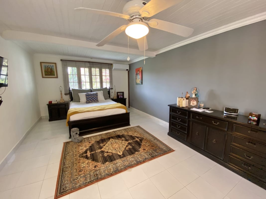 Spacious living dining room with large windows and garden outlook house Las Cumbres Panama