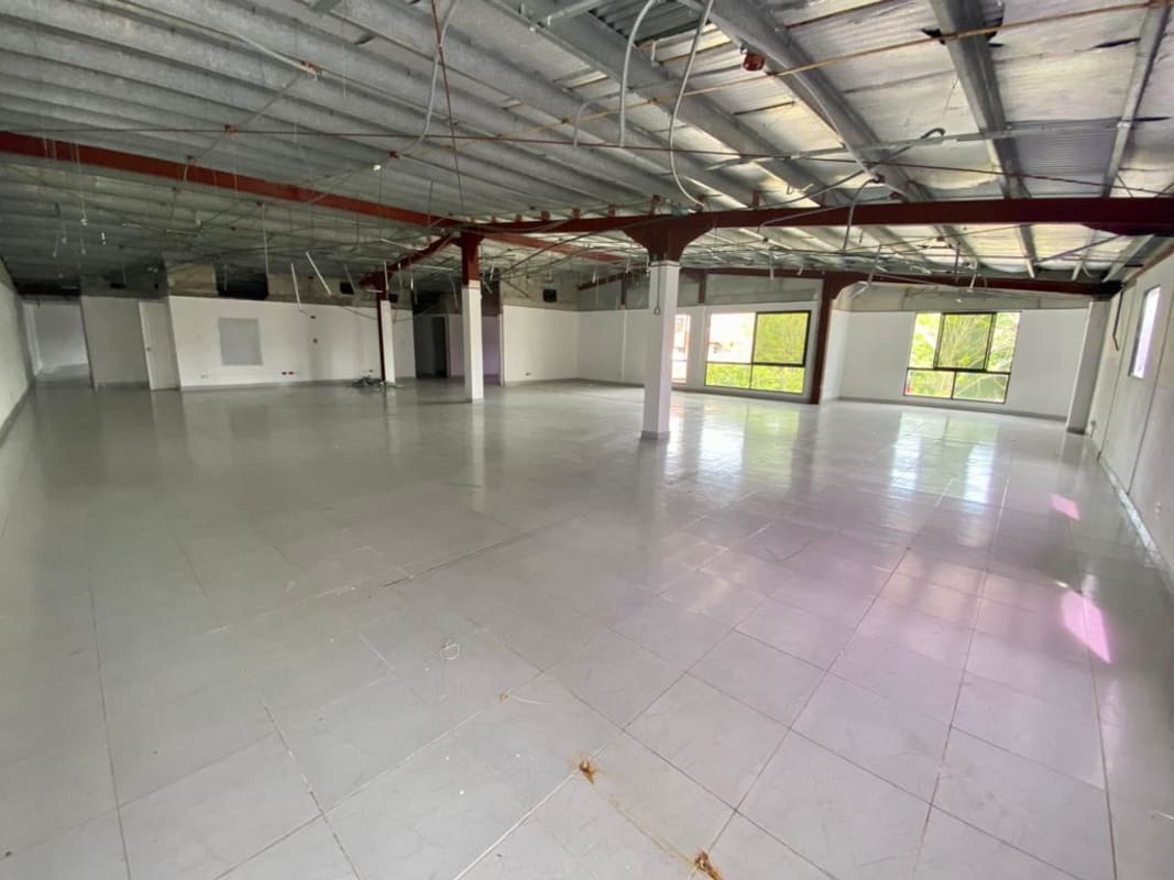 Large empty commercial interior with metal beams unfinished for customization Albrook