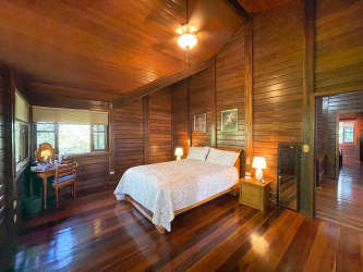 Modern kitchen with granite countertops, wood ceiling, stainless appliances at Brisas de los Lagos La Chorrera