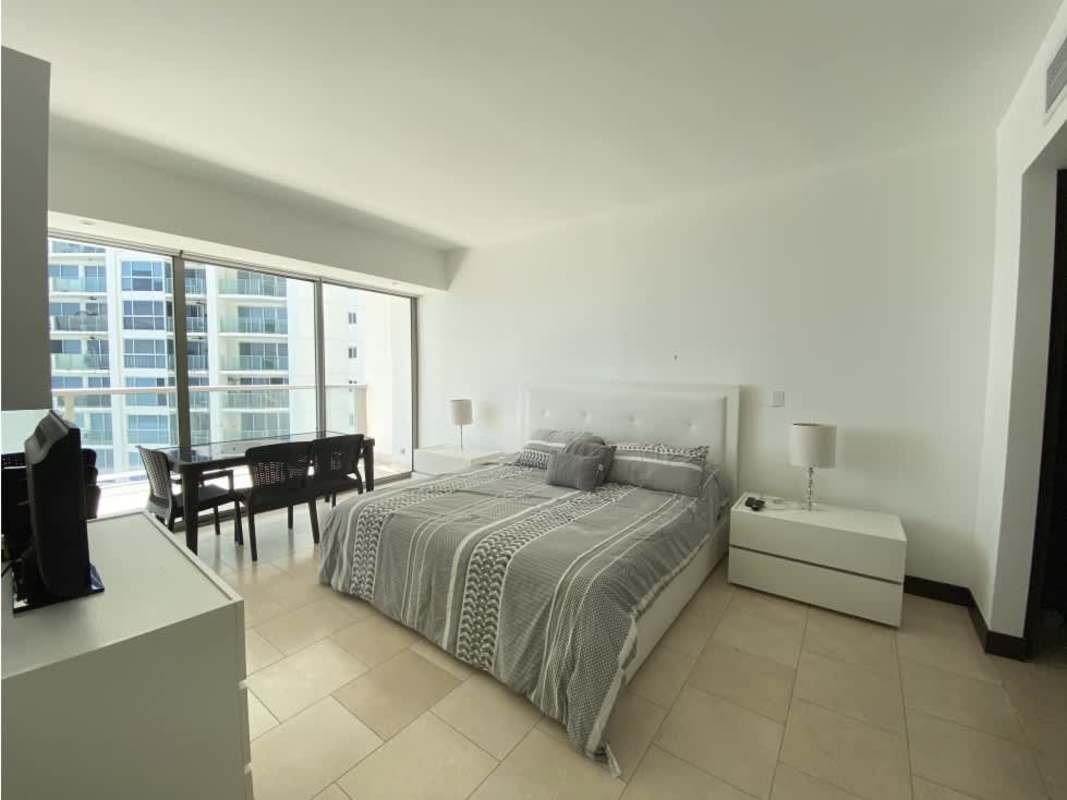 Large bedroom with floor-to-ceiling window ocean views in The Ocean Club Punta Pacifica Panama