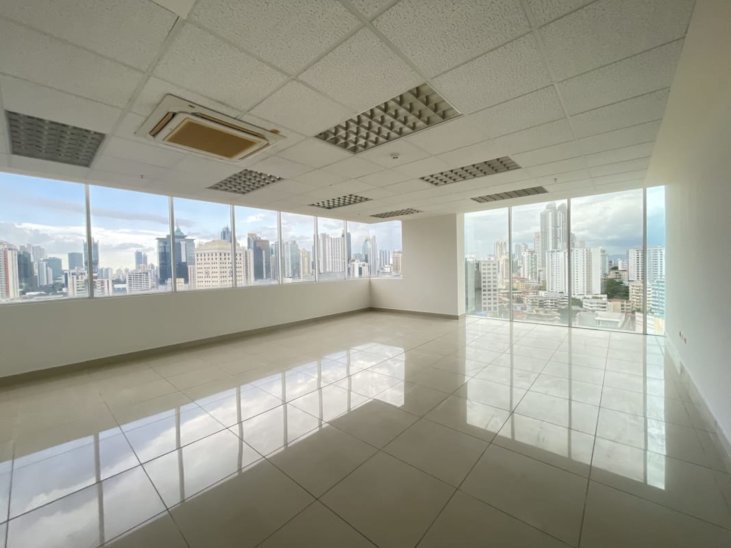 Spacious open plan office floor with removable glass divisions at PH BICSA Panama