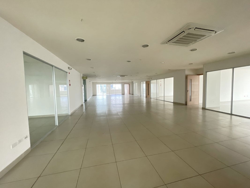 Open plan office area with panoramic windows and skyline ocean view PH BICSA Tower