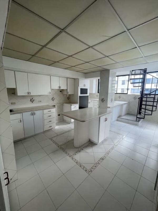 Open concept living space with panoramic windows polished stone floors Coco del Mar luxury penthouse Panama