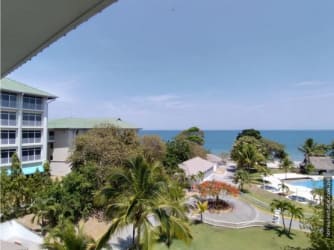 Spacious living dining area with ocean view terrace in Bijao Beach Club condo Panama