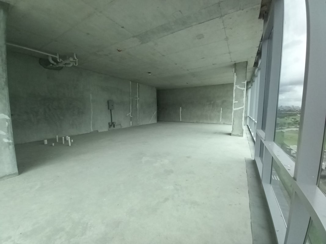 Open unfinished commercial office floor with panoramic windows in Costa del Este Panama