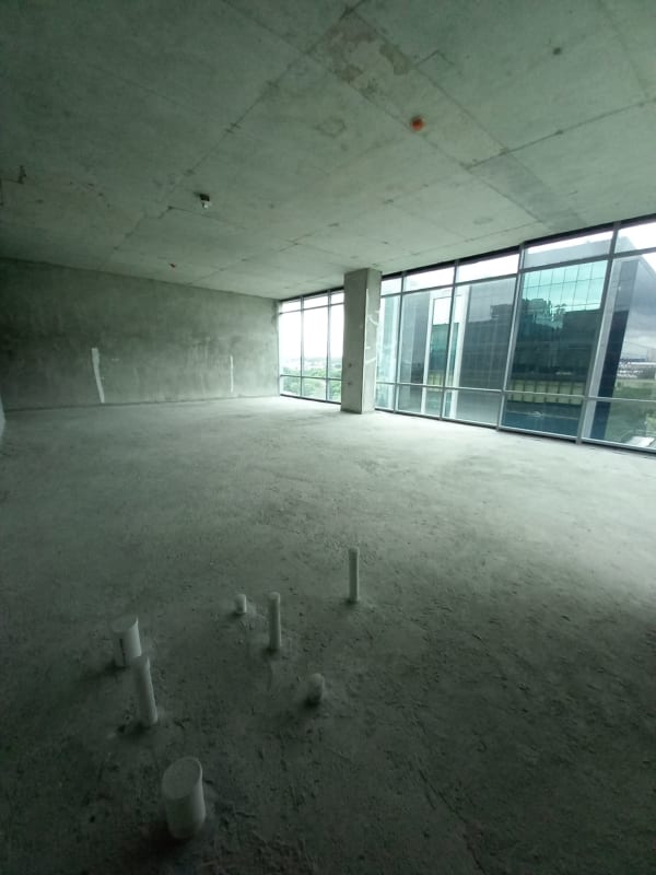 Unfinished office with floor-to-ceiling windows overlooking Costa del Este skyline Panama