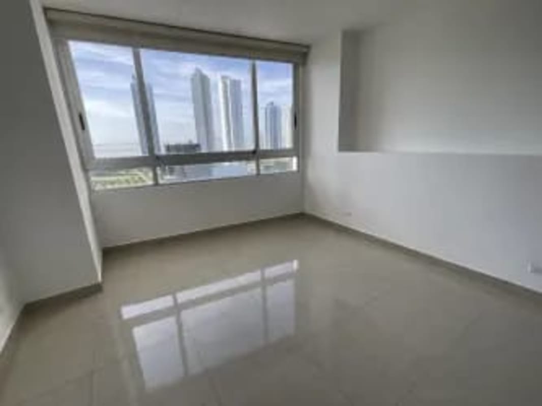 Bedroom with panoramic window overlooking city skyline in PH Elevation Costa del Este Panama