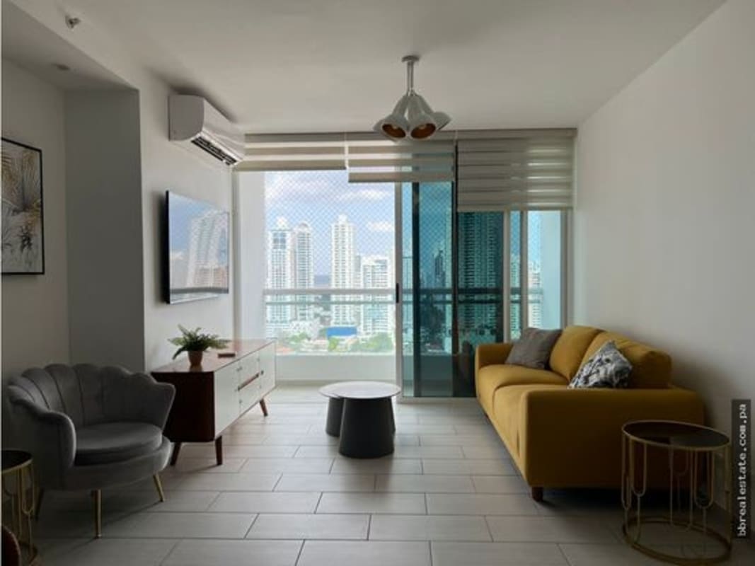 Master bedroom featuring large windows panoramic city views PH The Towers Punta Pacifica