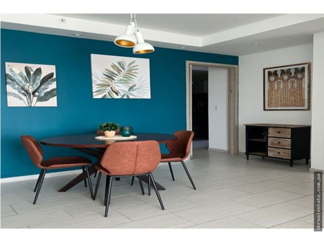 Bright living room with large windows city skyline view PH The Towers Panama City