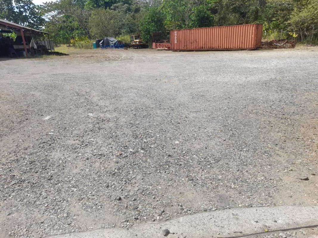 View of access road gated entrance neighborhood surroundings of commercial lot for sale Panama