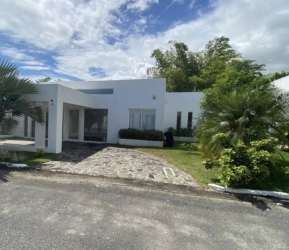 Comfortable bedroom with colorful wall art, large glass doors, garden views in Ibiza Beach Residences Panama