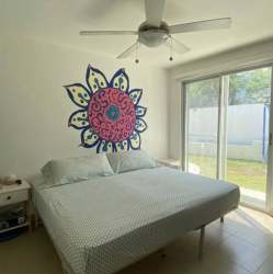 Open concept living dining with modern decor at Ibiza Beach Residences furnished beach villa Panama