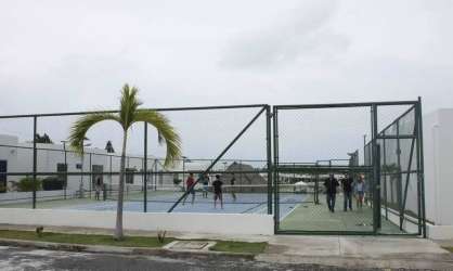 Secured gated entry Ibiza Beach Residences with signage and palm landscaping in Panama