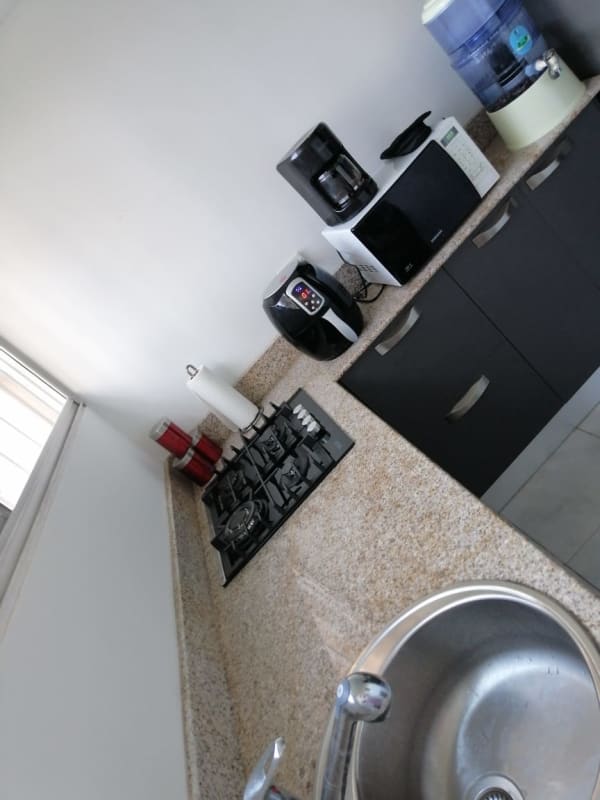 Bright living dining room opening to ground floor terrace at PH Llano Bonito Panama