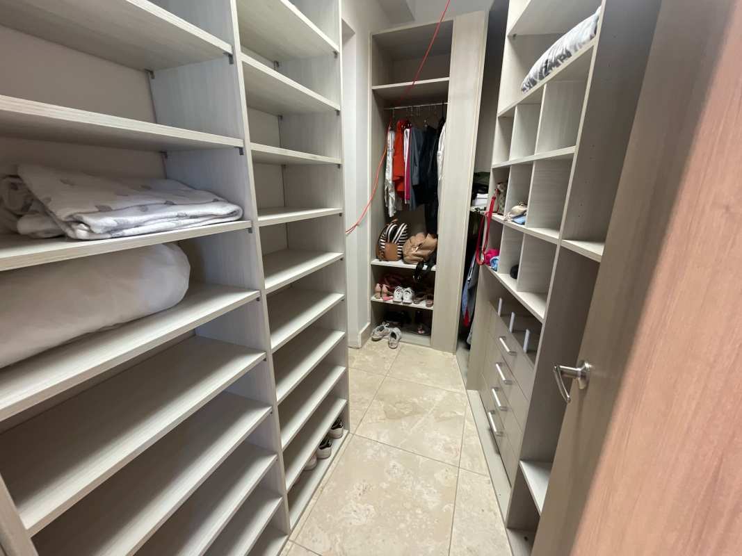 Closed kitchen with stainless appliances and breakfast area at PH Deluxe Residences luxury apartment Panama City