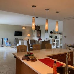 Elegant living and dining room, open concept with neutral decor in beachfront furnished apartment Buenaventura Panama
