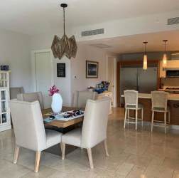 Covered outdoor balcony with grill overlooking gardens in furnished apartment Buenaventura Panama